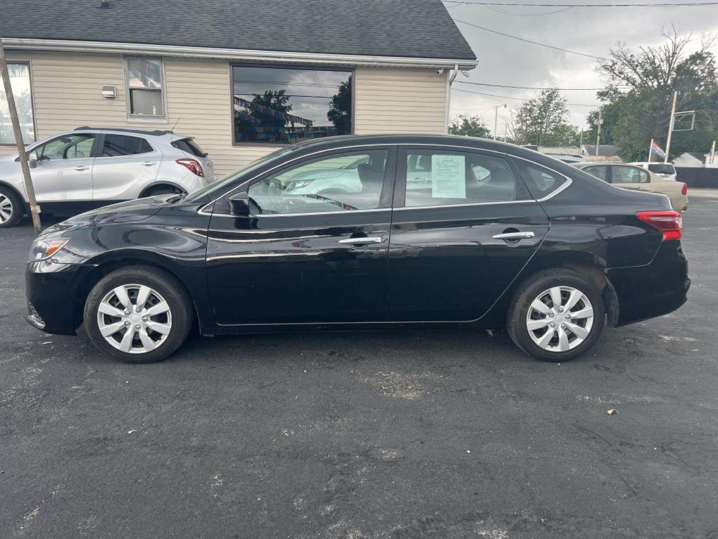 2018 BLACK NISSAN SENTRA S (3N1AB7AP6JY) with an 1.8L engine, Continuously Variable transmission, located at 1056 E Riverside Dr, Evansville, IN, 47714, (812) 423-7026, 37.953491, -87.546654 - Photo#0