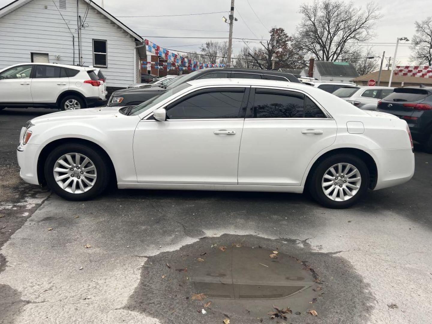 2013 WHITE CHRYSLER 300 (2C3CCAAG7DH) with an 3.6L engine, Automatic transmission, located at 1056 E Riverside Dr, Evansville, IN, 47714, (812) 423-7026, 37.953491, -87.546654 - Photo#0