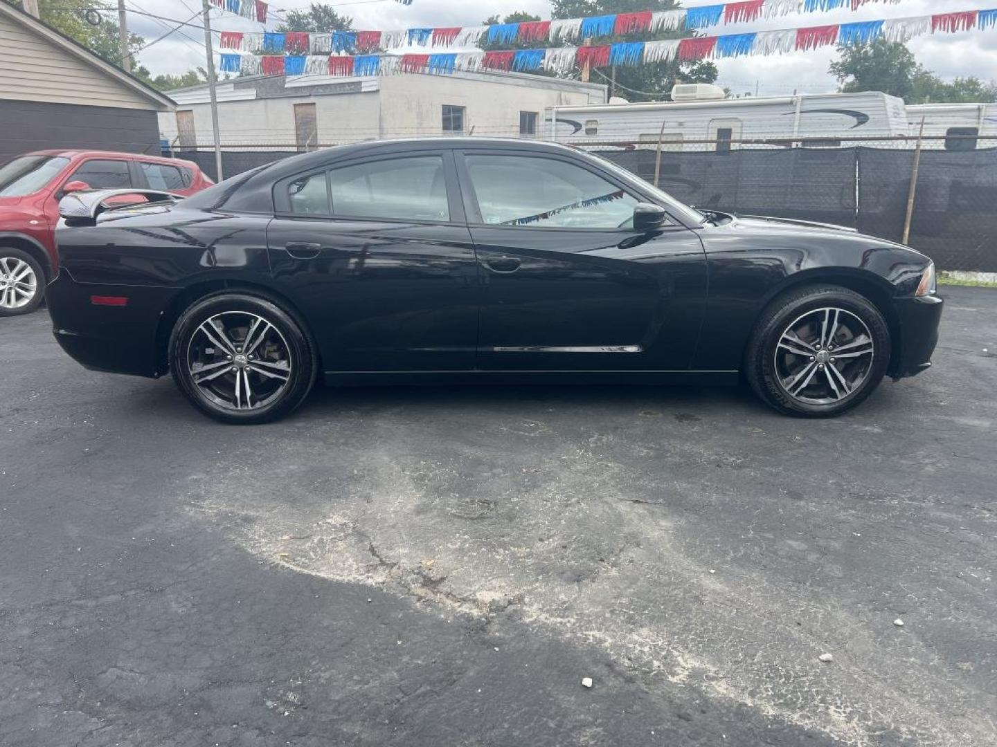 2013 BLACK DODGE CHARGER SXT (2C3CDXJG2DH) with an 3.6L engine, Automatic transmission, located at 1056 E Riverside Dr, Evansville, IN, 47714, (812) 423-7026, 37.953491, -87.546654- Photo#0