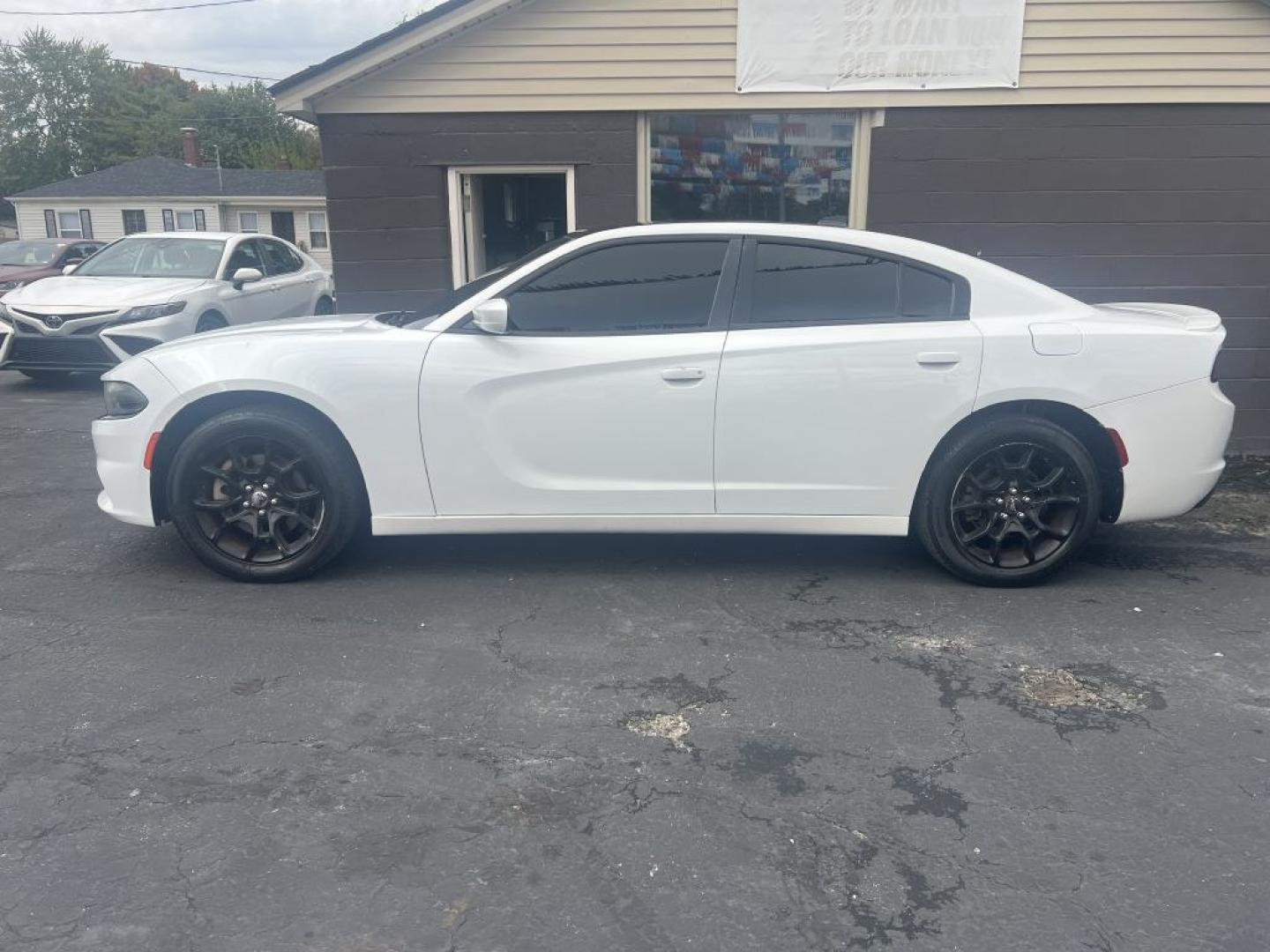 2016 WHITE DODGE CHARGER SXT (2C3CDXJGXGH) with an 3.6L engine, Automatic transmission, located at 1056 E Riverside Dr, Evansville, IN, 47714, (812) 423-7026, 37.953491, -87.546654- Photo#0