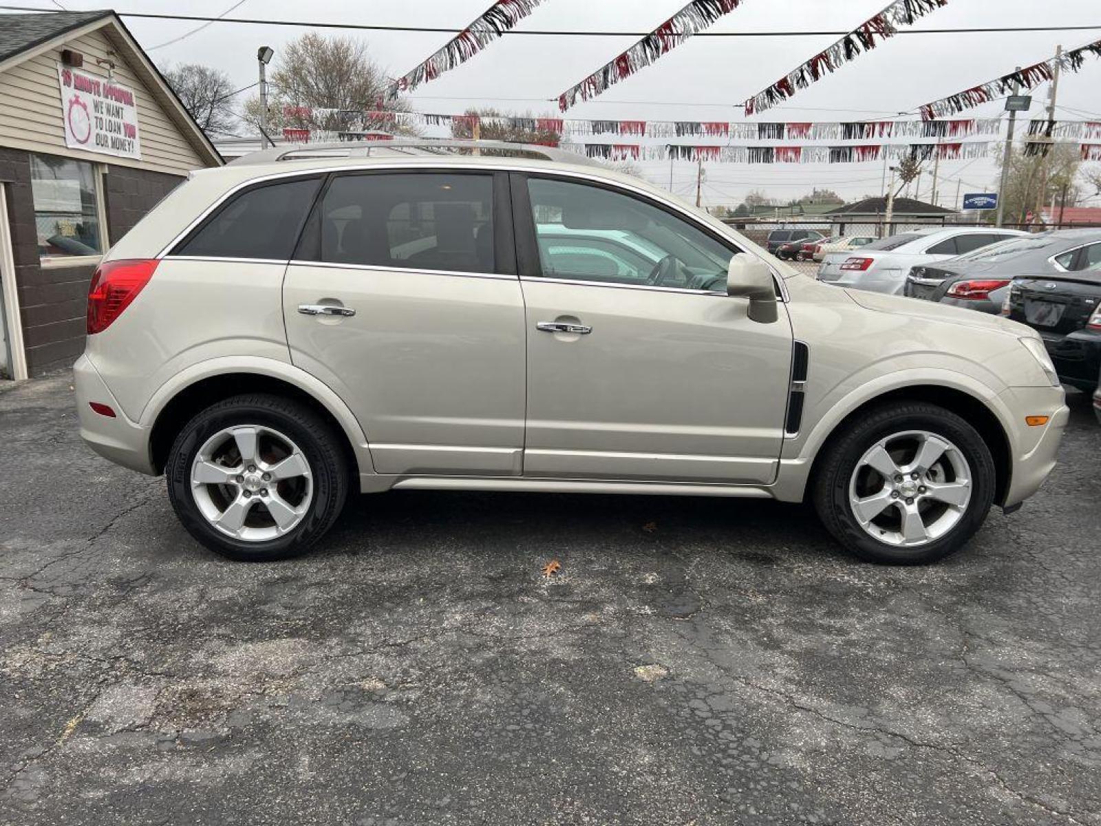 2014 GOLD CHEVROLET CAPTIVA LTZ (3GNAL4EK4ES) with an 2.4L engine, Automatic transmission, located at 1056 E Riverside Dr, Evansville, IN, 47714, (812) 423-7026, 37.953491, -87.546654 - Photo #0