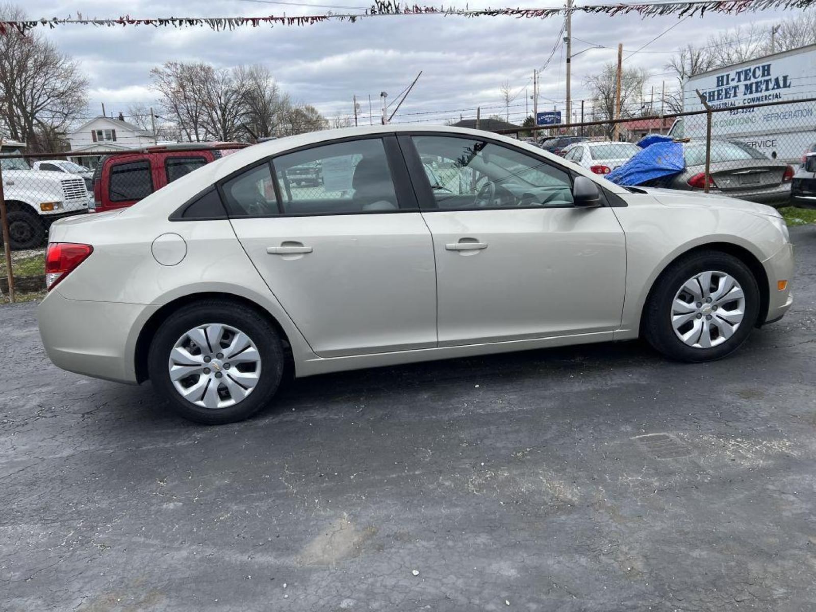 2013 GOLD CHEVROLET CRUZE LS (1G1PA5SH9D7) with an 1.8L engine, Automatic transmission, located at 1056 E Riverside Dr, Evansville, IN, 47714, (812) 423-7026, 37.953491, -87.546654 - Photo #0