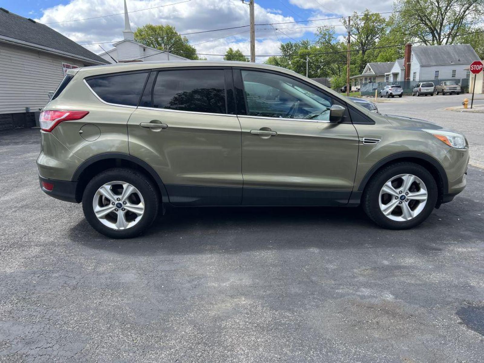 2014 GREEN FORD ESCAPE SE (1FMCU0GX9EU) with an 1.6L engine, Automatic transmission, located at 1056 E Riverside Dr, Evansville, IN, 47714, (812) 423-7026, 37.953491, -87.546654 - Photo #0