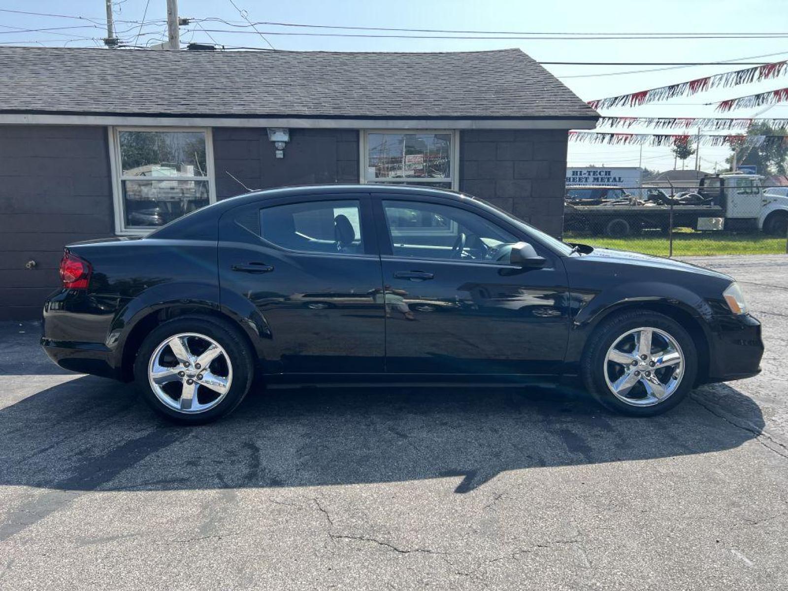 2013 BLACK DODGE AVENGER SE (1C3CDZAB5DN) with an 2.4L engine, Automatic transmission, located at 1056 E Riverside Dr, Evansville, IN, 47714, (812) 423-7026, 37.953491, -87.546654 - Photo #0
