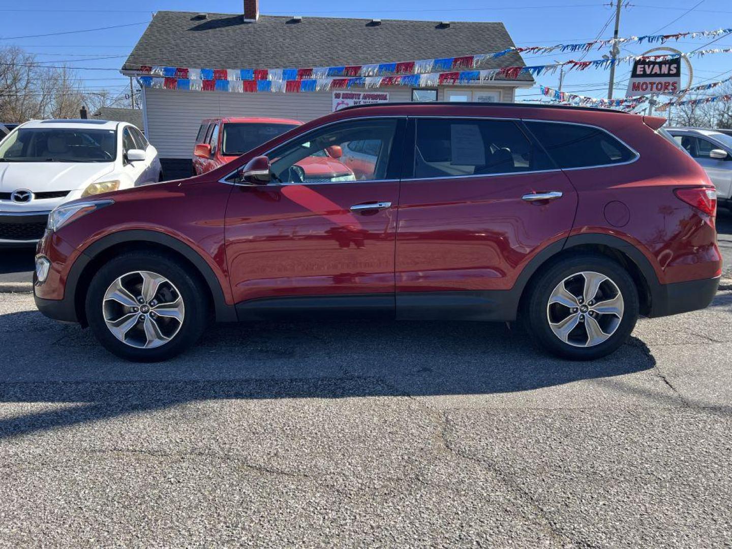 2014 RED HYUNDAI SANTA FE GLS (KM8SN4HF4EU) with an 3.3L engine, Automatic transmission, located at 1056 E Riverside Dr, Evansville, IN, 47714, (812) 423-7026, 37.953491, -87.546654 - Photo#0