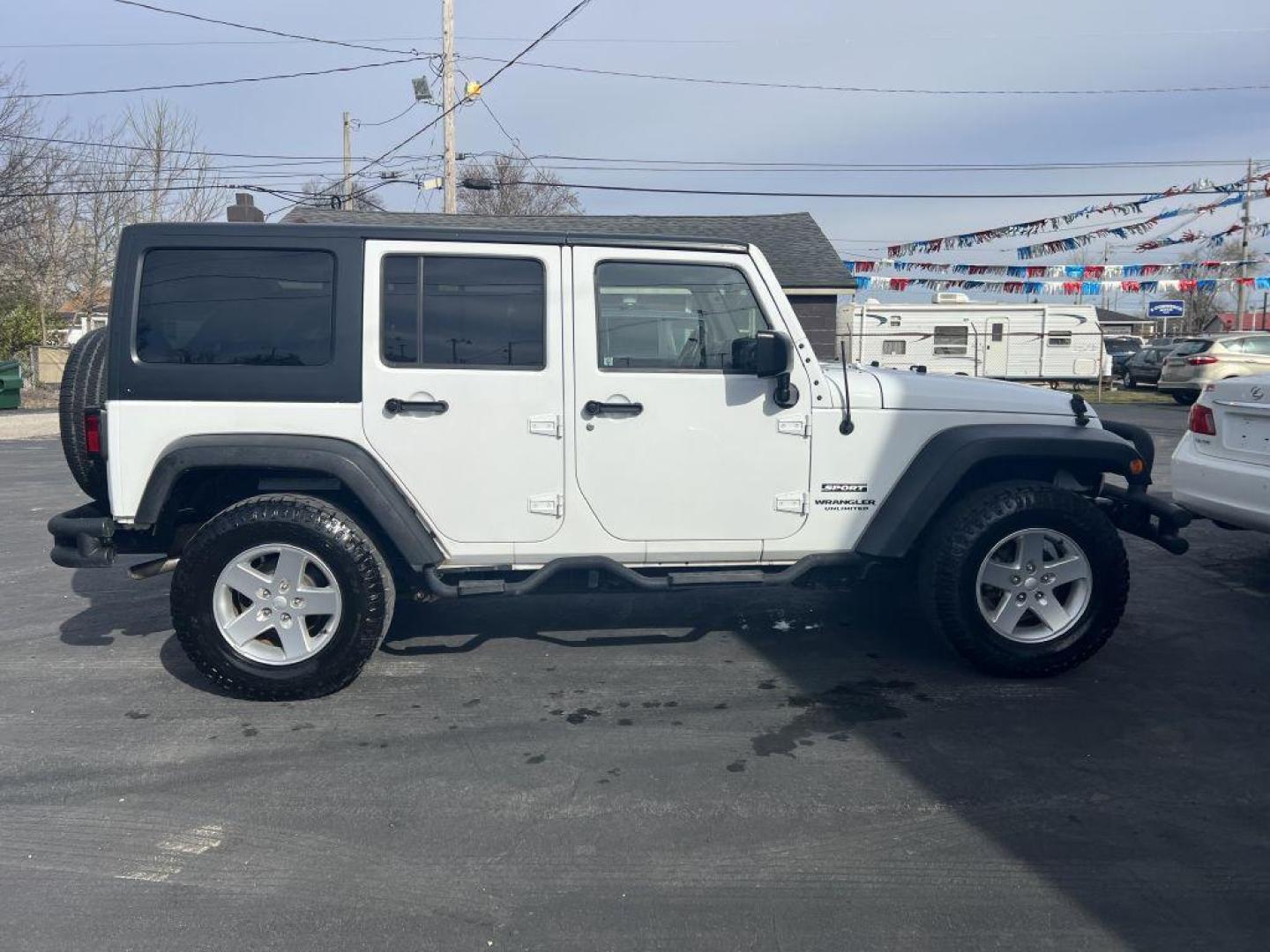 2015 WHITE JEEP WRANGLER UNLIMI SPORT (1C4HJWDG7FL) with an 3.6L engine, Automatic transmission, located at 1056 E Riverside Dr, Evansville, IN, 47714, (812) 423-7026, 37.953491, -87.546654 - Photo#0